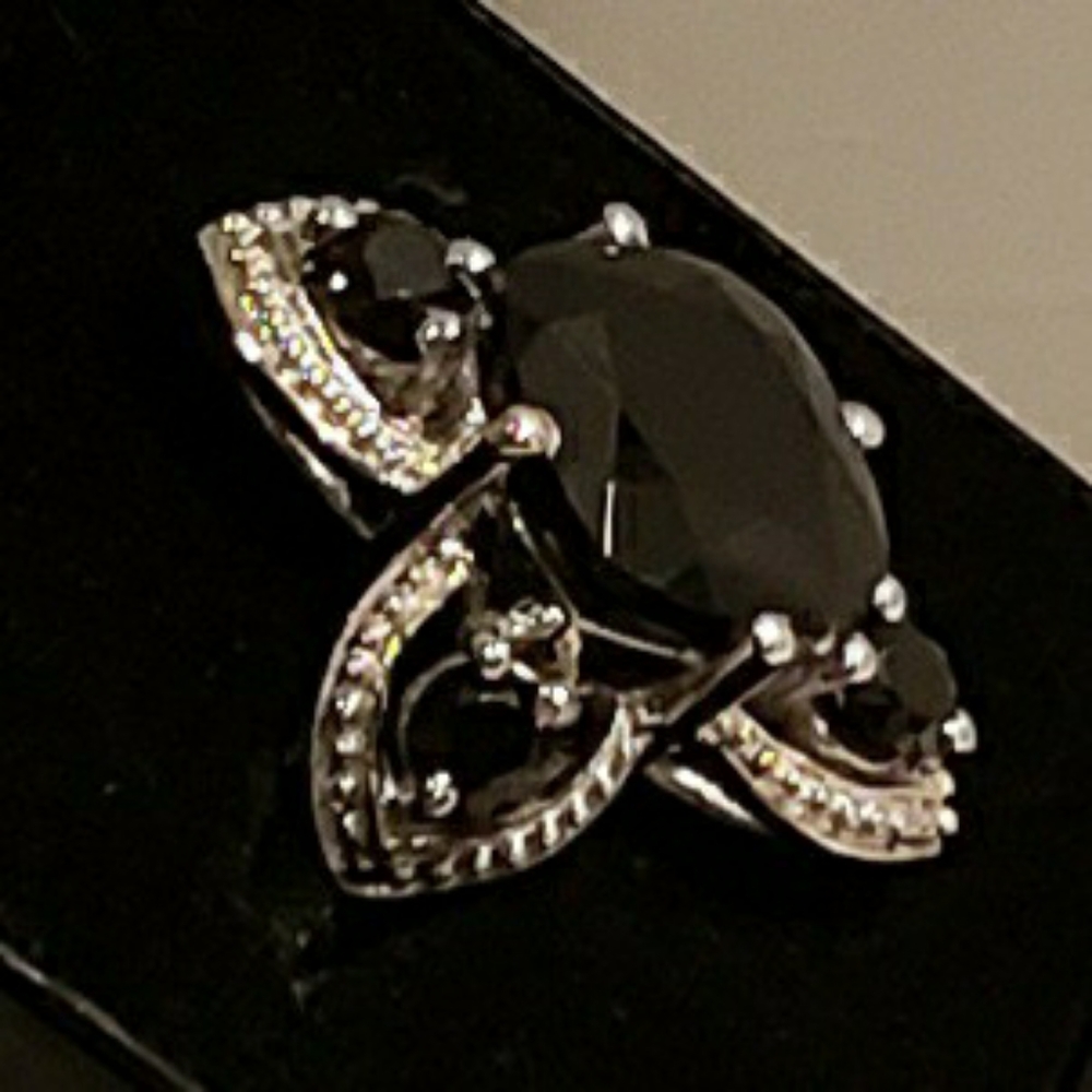 Platinum/Rodium plated Sterling Silver ring.